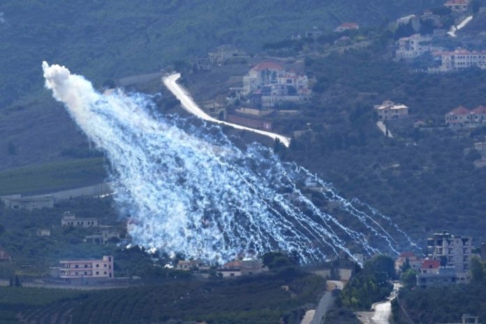 Artillery-delivered white phosphorus munition being airburst over Kfar Kila, a Lebanese border village with Israel, as seen from Marjayoun in southern Lebanon, November 22, 2023. © 2023 Hussein Malla/AP Photo